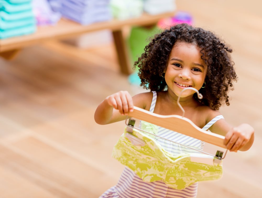 Beautiful shopping girl at a retail store looking very happy